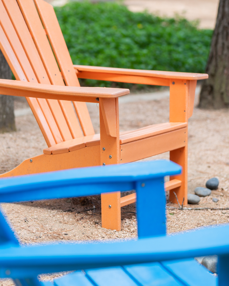 Colorful Adirondack chairs can be found in some of Woodforest's community parks.