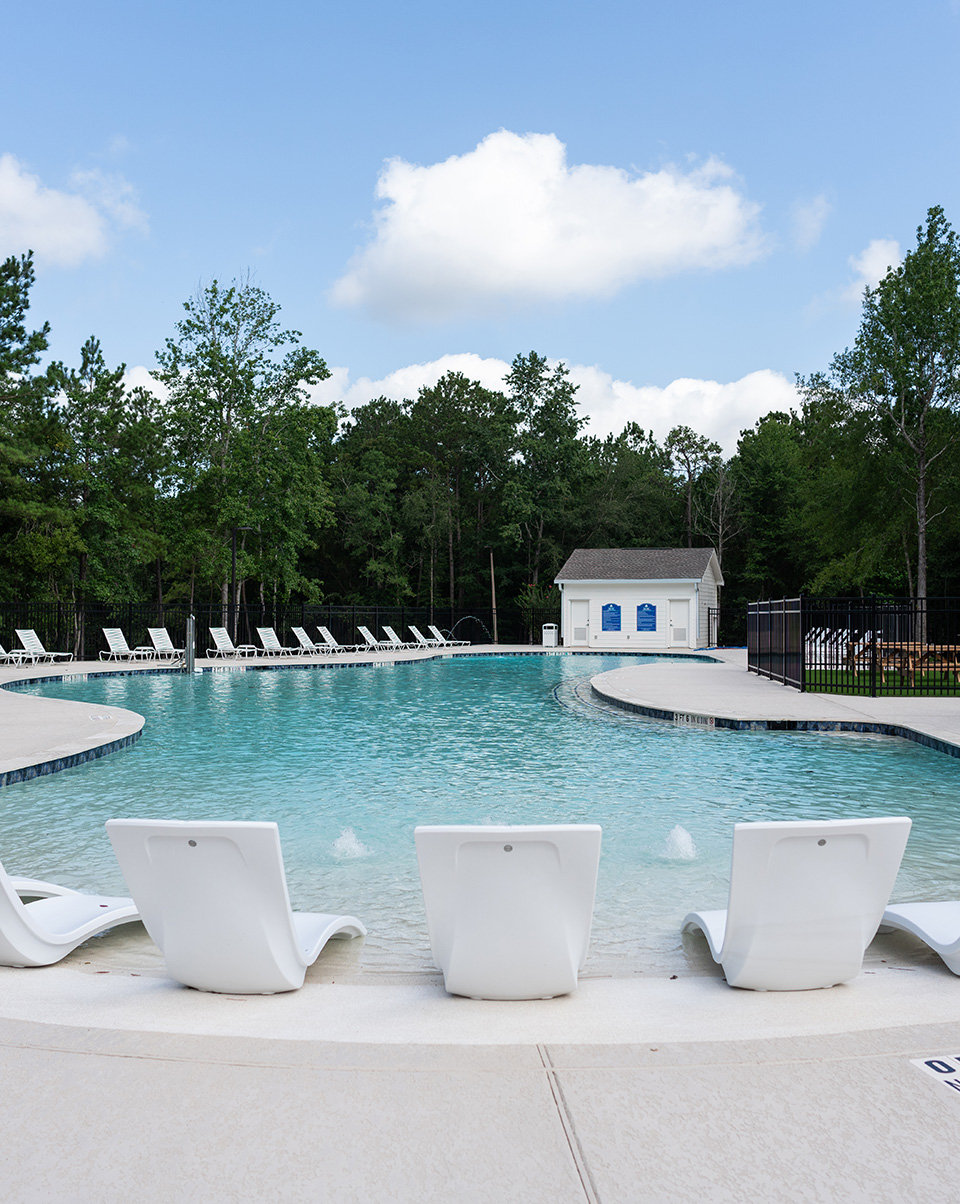 Poolside and tanning ledge of The Vue at The Crest Park in Woodforest.