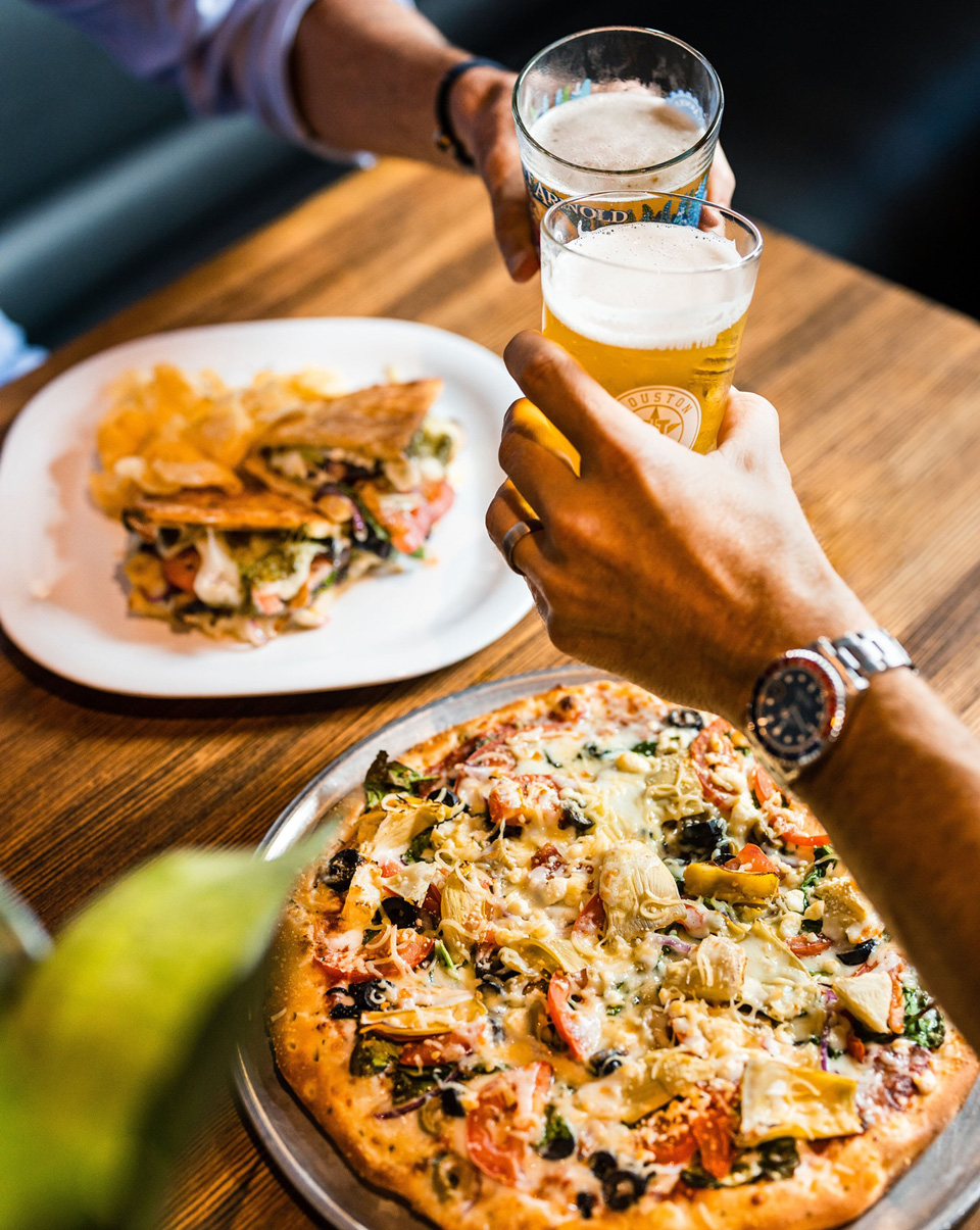 The Shops at Woodforest in Montgomery, TX include restaurants like Crust Pizza.