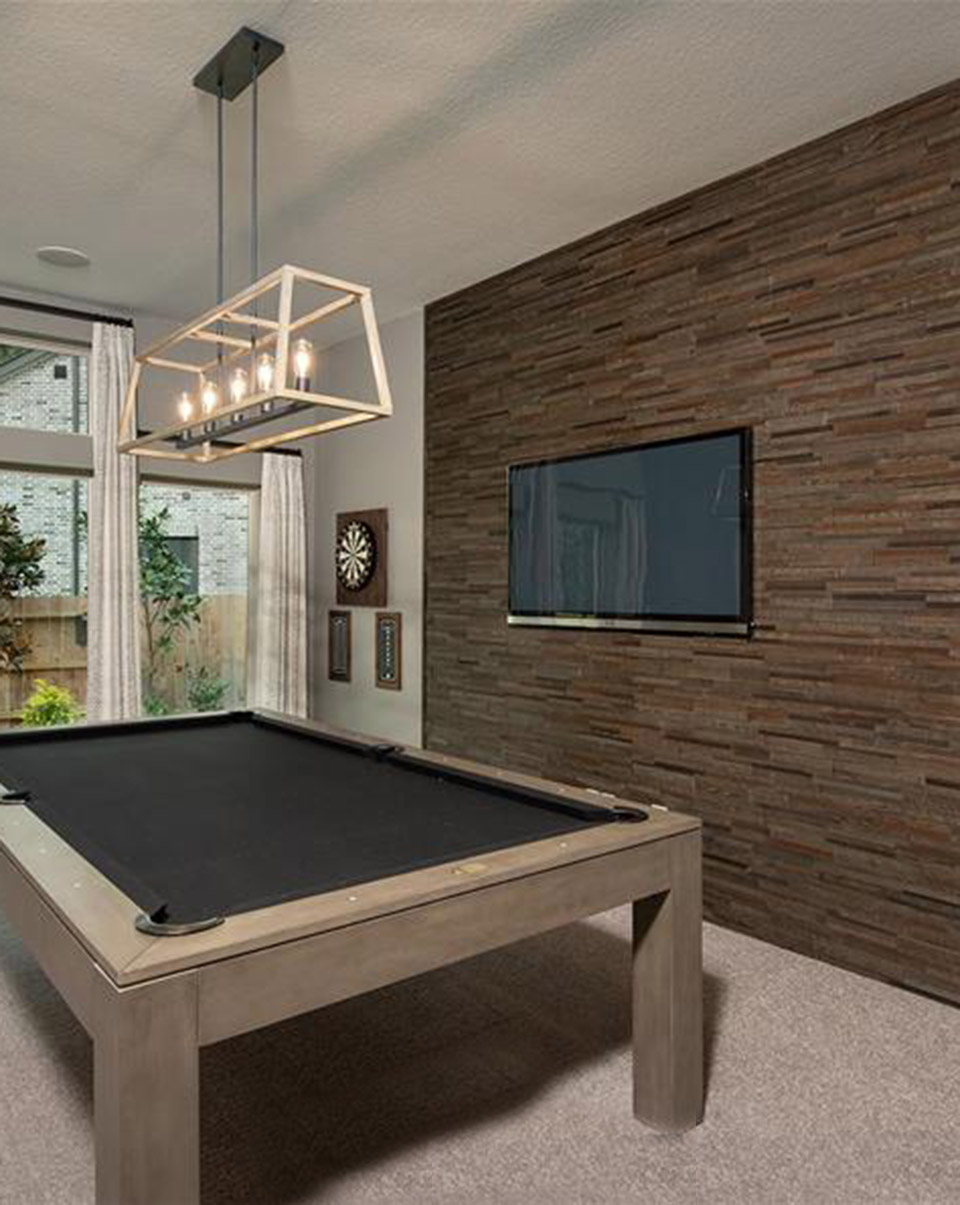 Dark wood plank statement wall design inspiration staged in Woodforest model home.