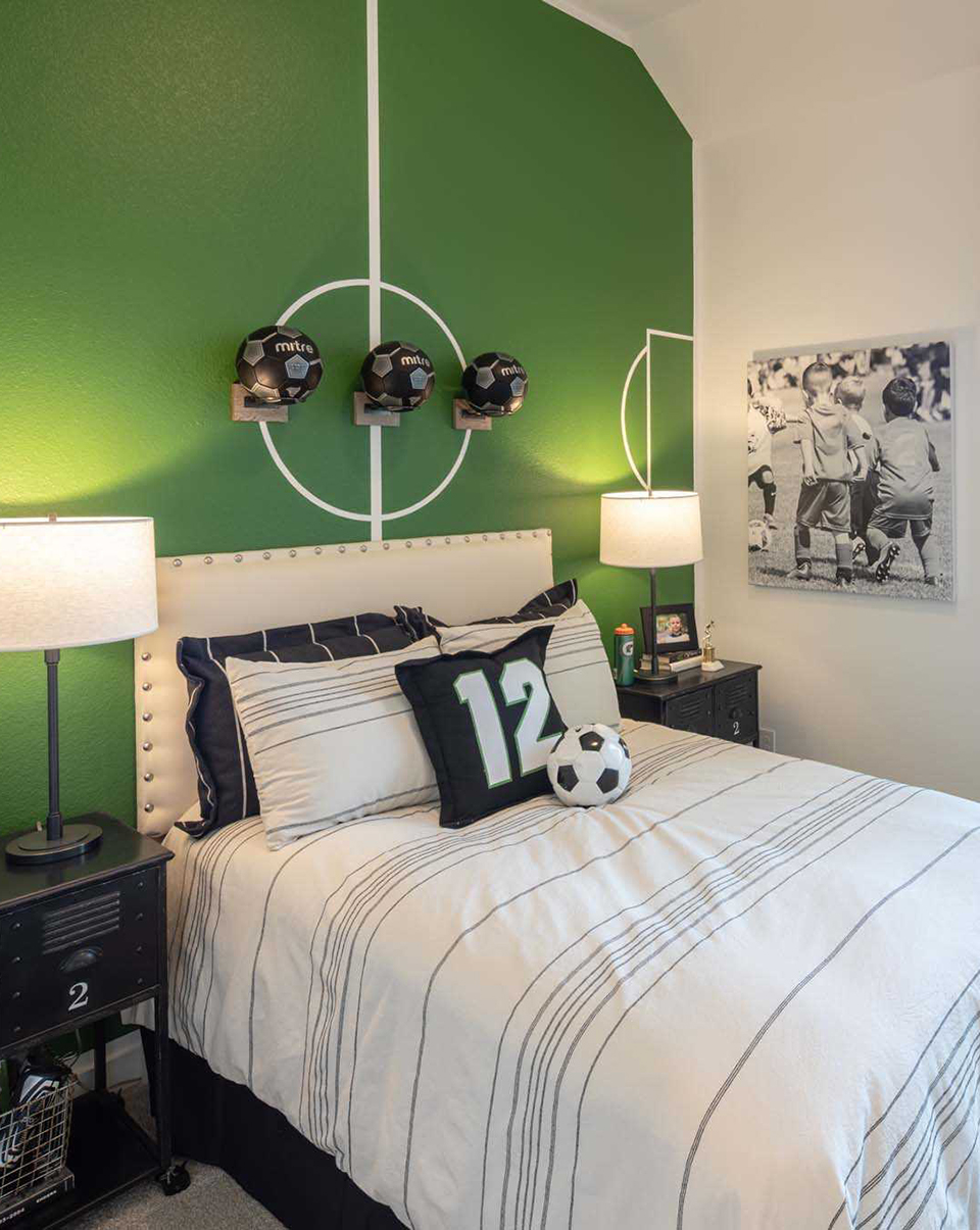 Bright green statement wall design inspiration for kids staged in Woodforest model home.