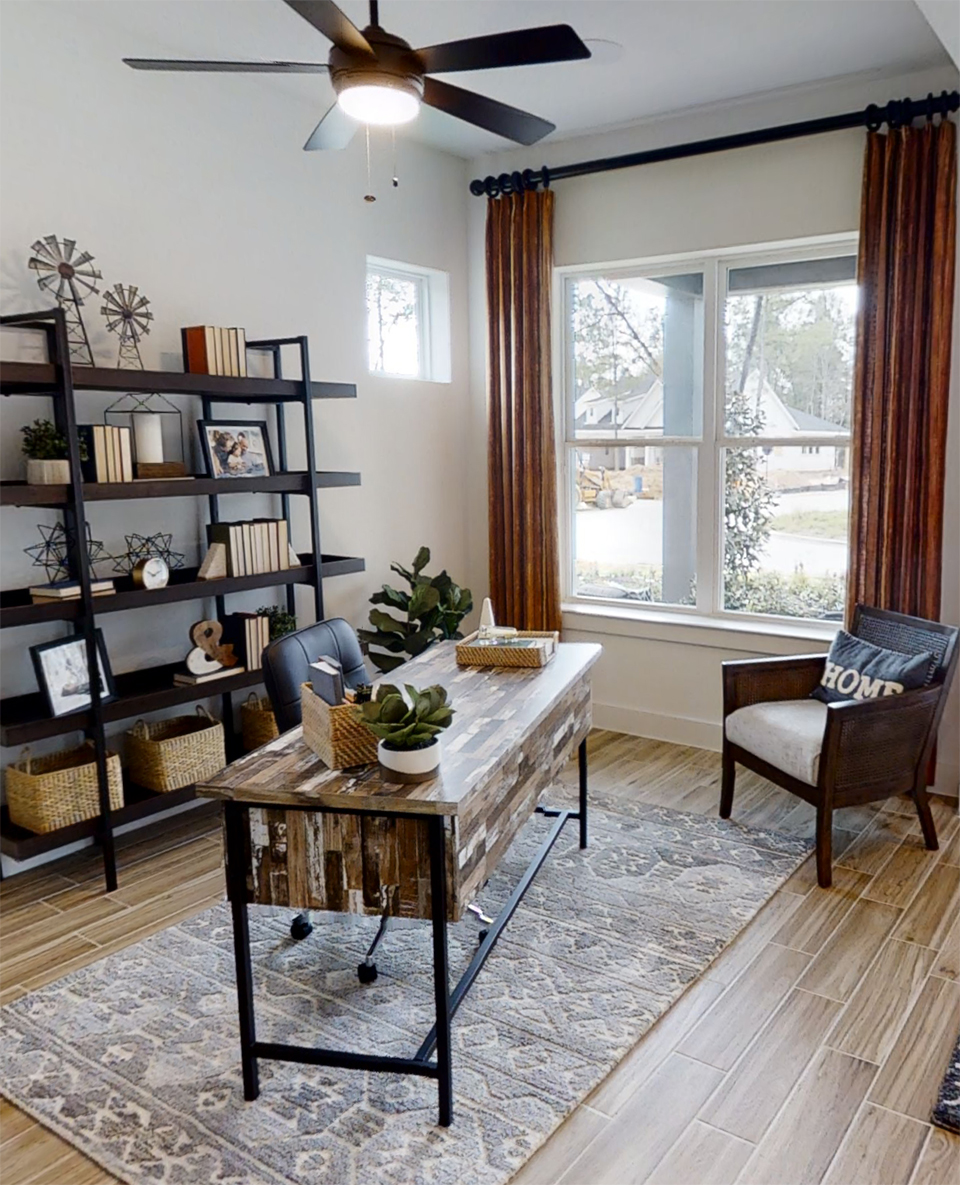 Bold colors with natural themes in home office staged in Woodforest model home.