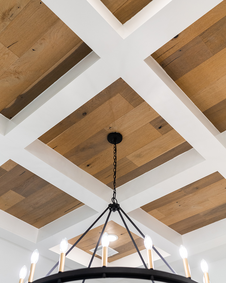 Wood and white ceiling home design inspiration staged in a Woodforest model home.