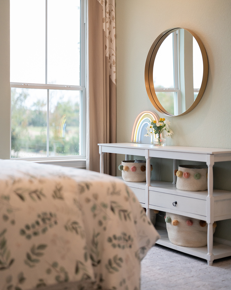 Bedroom design inspiration with warm colors and woods in Woodforest model home.